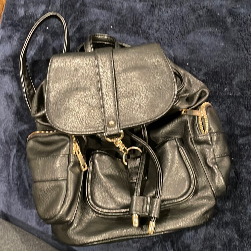 Its from Forever 21!! Black colored small bag pack!